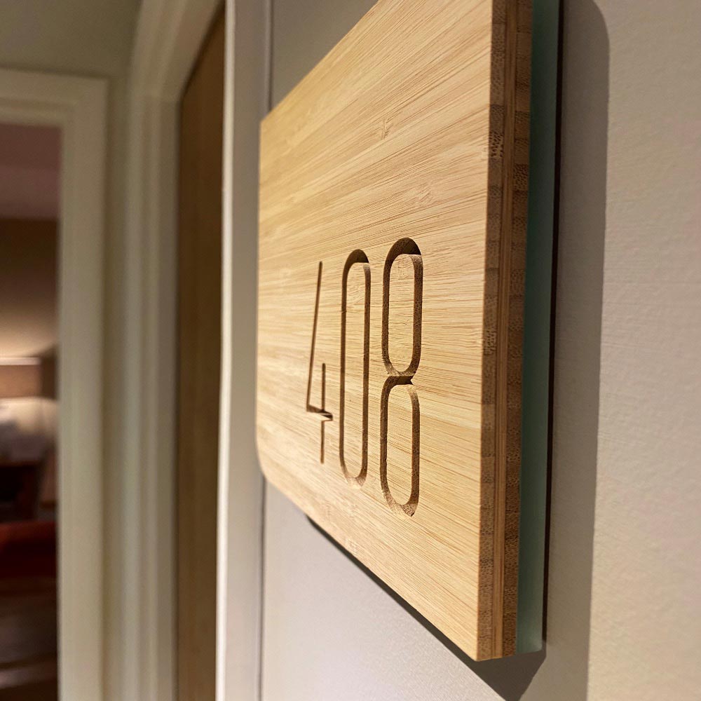 Wood hotel room signage