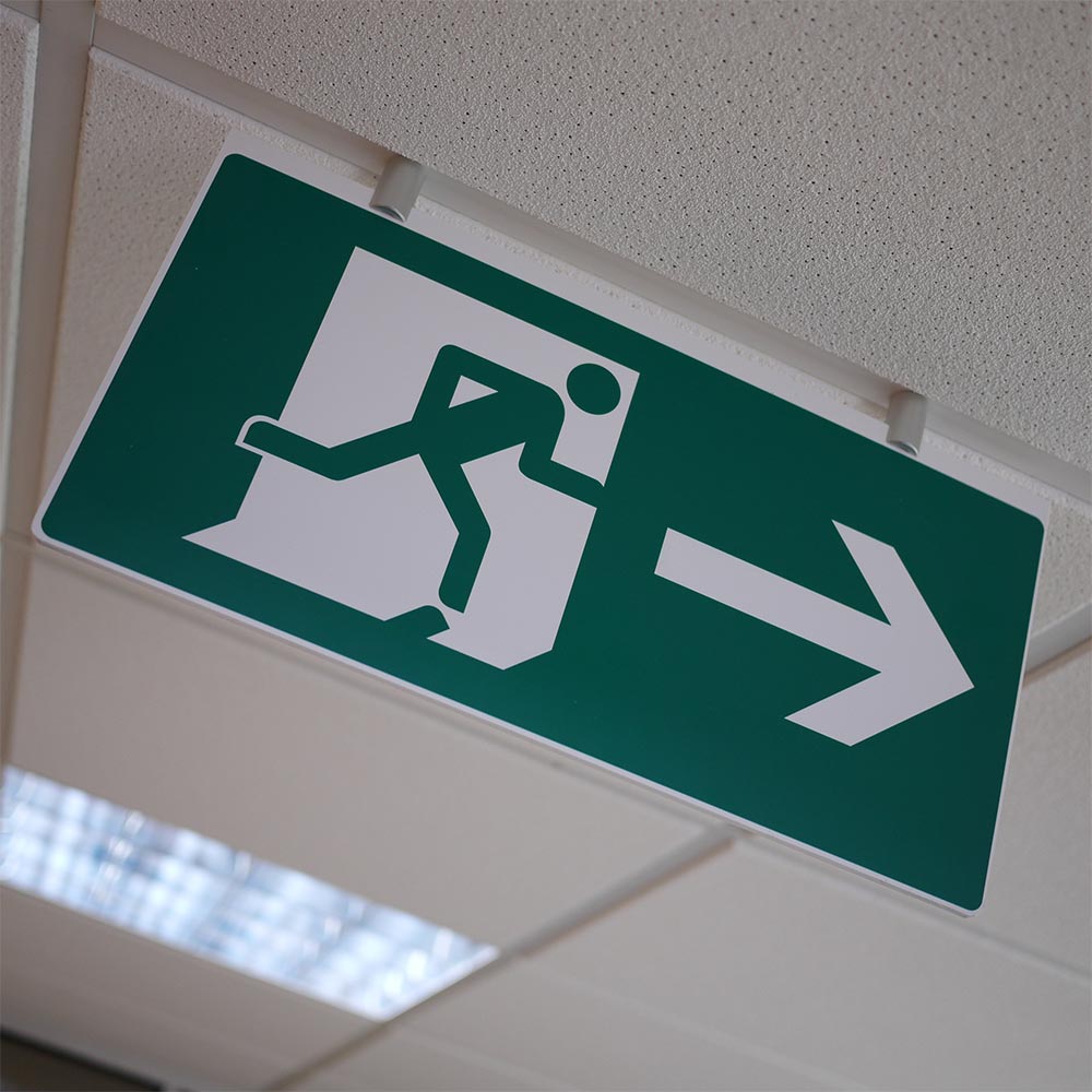 Cost-effective ceiling-suspended fire exit sign